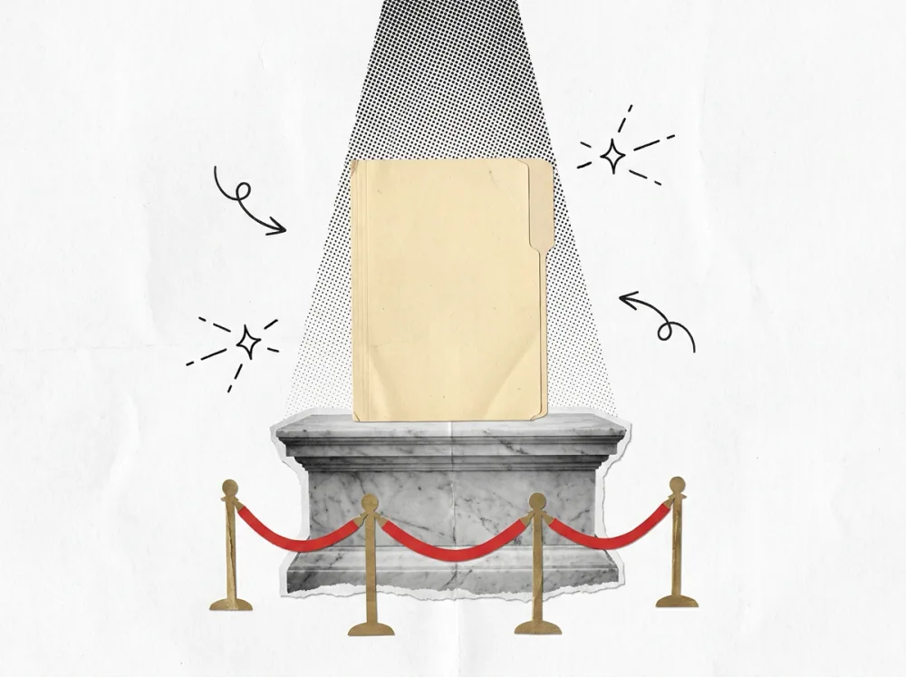 A plain manila folder on a marble museum pedestal, under a spotlight, behind a red velvet rope.